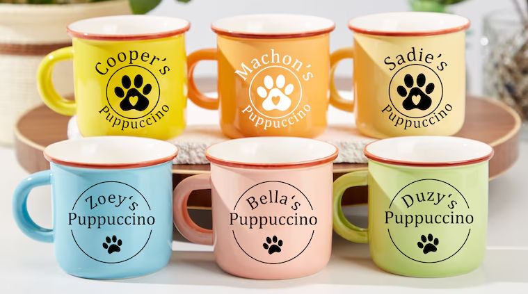 Personalized pet-themed mugs with 'Puppuccino' designs, a great example of print-on-demand products for Etsy dropshipping.